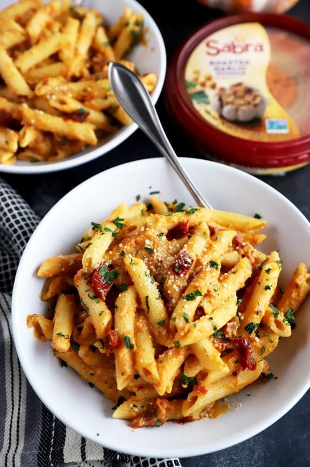 Fork in a bowl full of creamy pasta