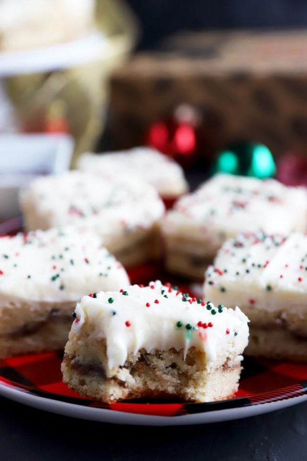 Bite out of a Christmas cookie bar on a plate photo