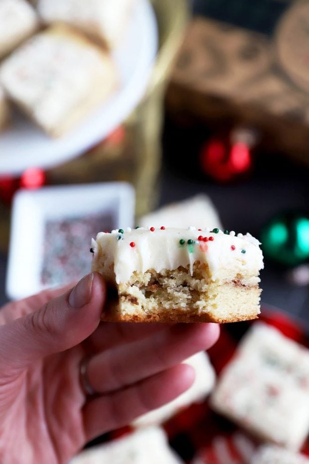 Photo of hand holiday a cookie bar with a bite taken out