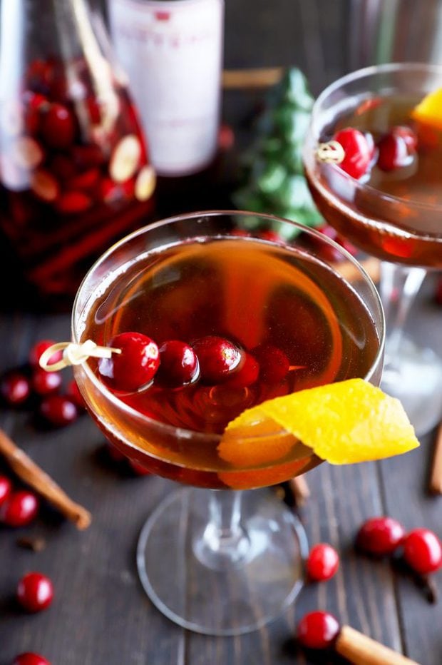 Cranberry spice Manhattan cocktail in a coupe glass photo