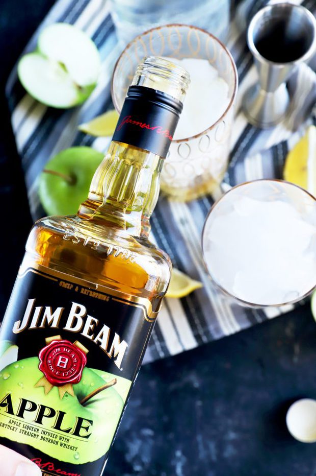 Pouring Jim Beam Apple into a cocktail glass