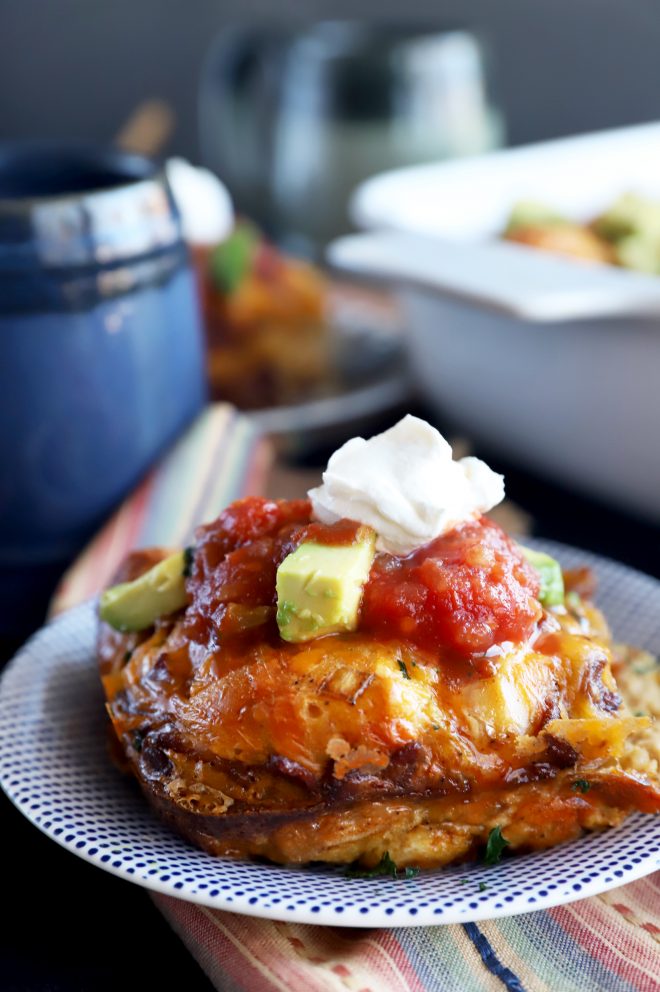 Side photo of Mexican breakfast bake with salsa and avocado