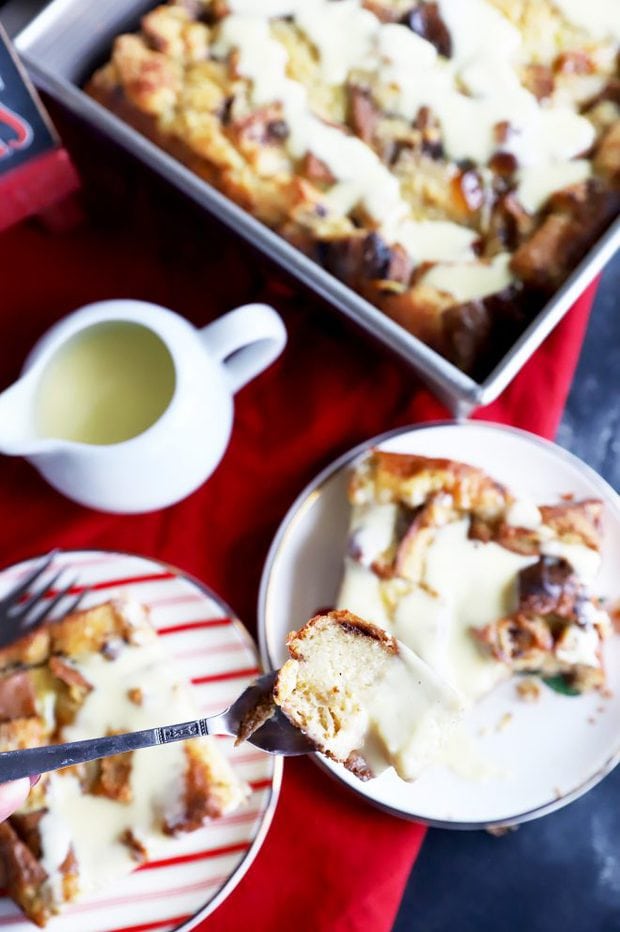 Forkful of bread pudding with creme anglaise
