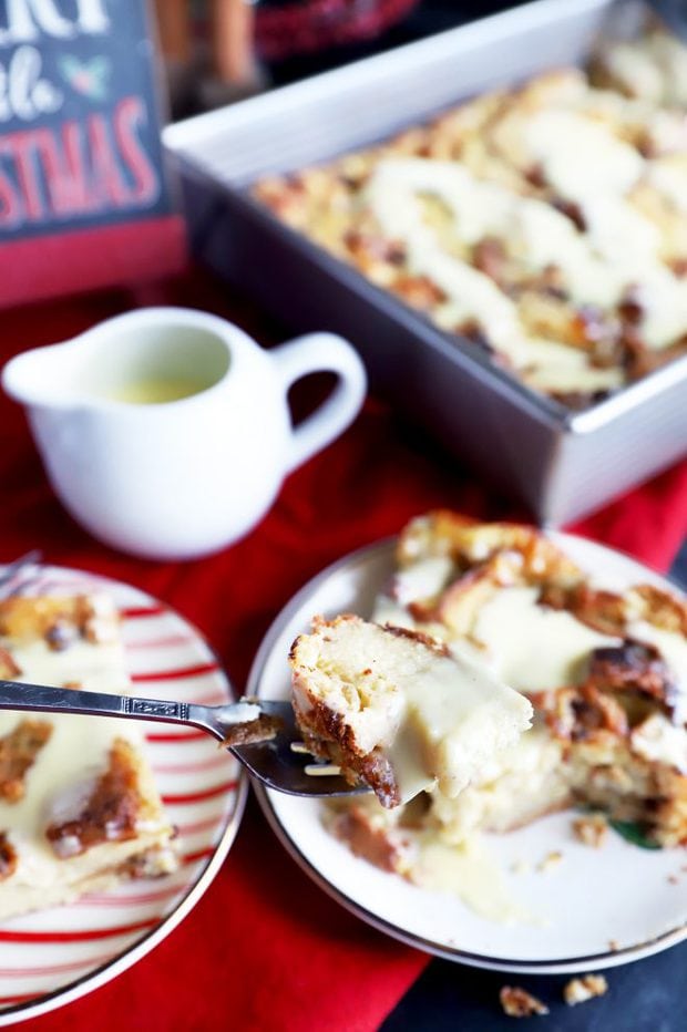 Photo of a fork with bread pudding and creme anglaise