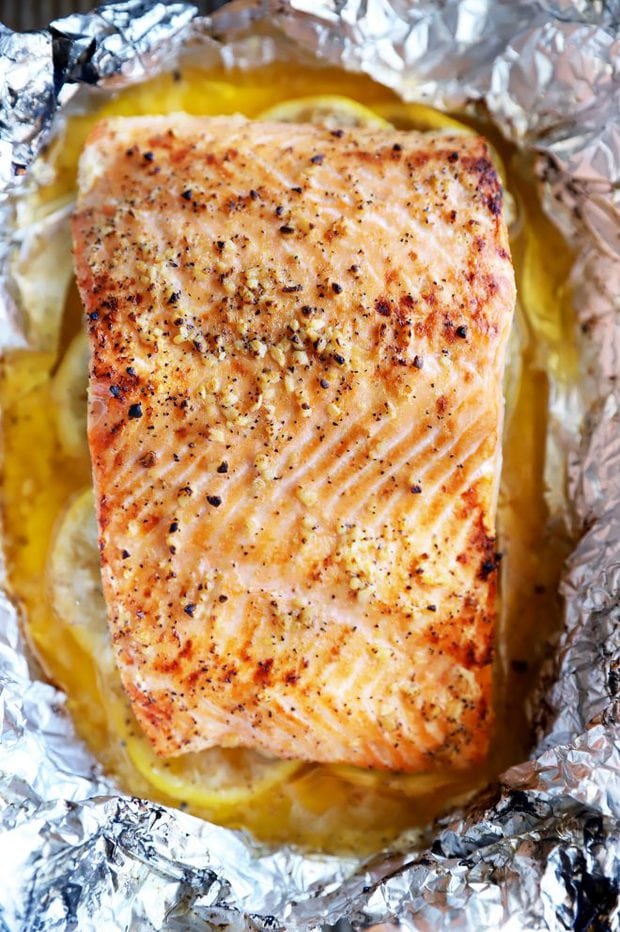 Baked salmon over lemon slices image