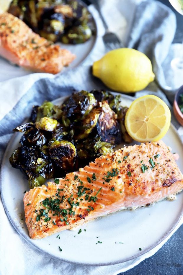 Salmon filet on a plate with brussels sprouts