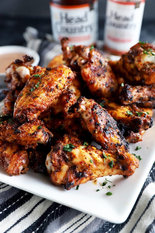 Side photo of dry rub wings on a platter