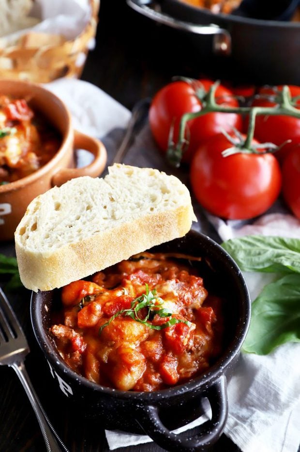 Gnocchi in a bowl with red meat sauce photo