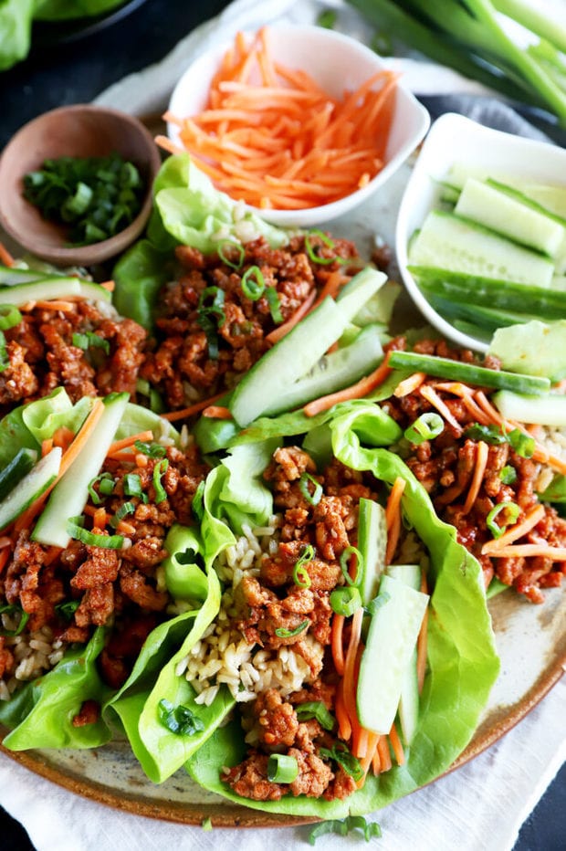 Lettuce wraps on a plate with toppings image