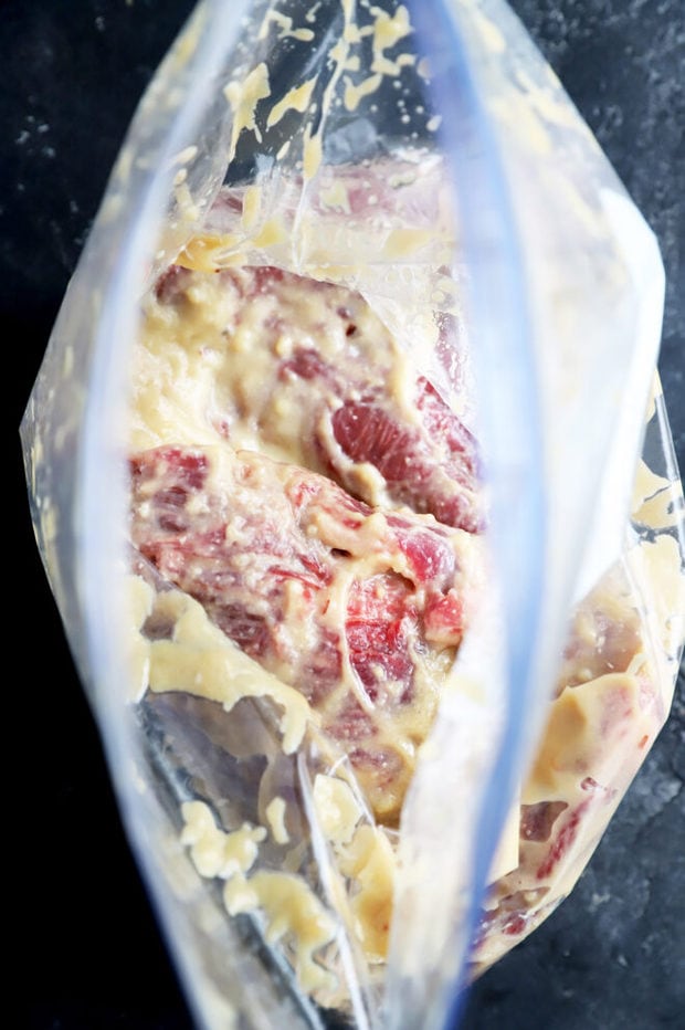 Picture of steak in marinade in a bag