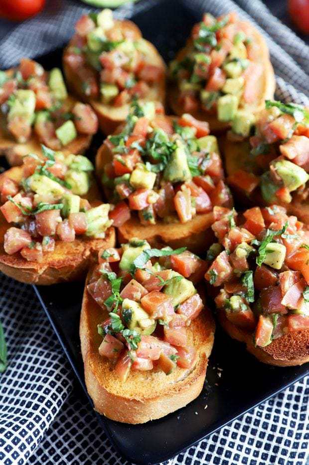 Photo of avocado bruschetta on a platter