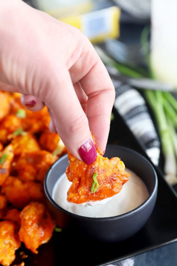 Dipping cauliflower in ranch picture