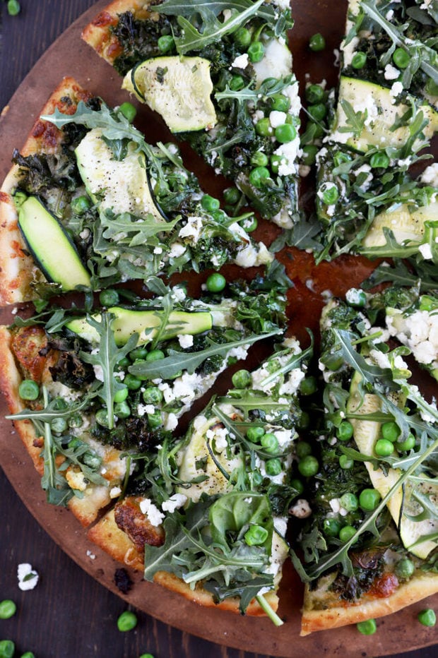 Picture of sliced pizza with greens