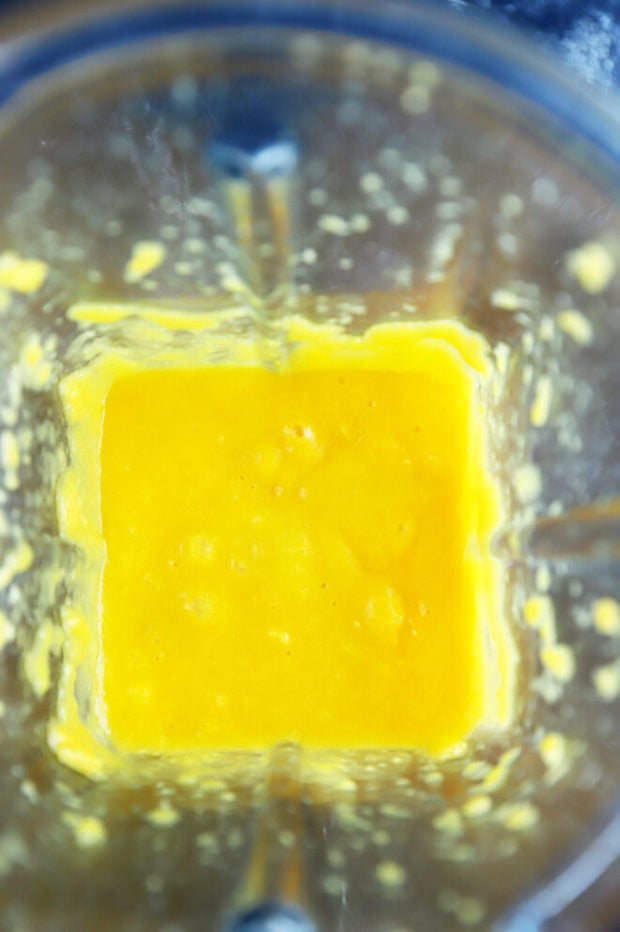 Pureed mango in a blender photo