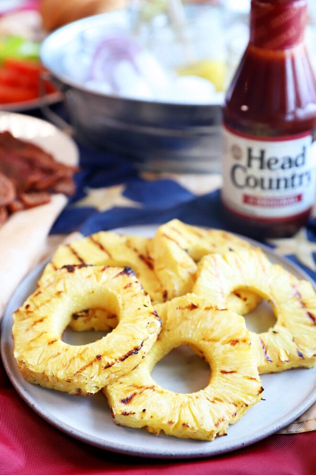 Grilled pineapple slices on a plate photo