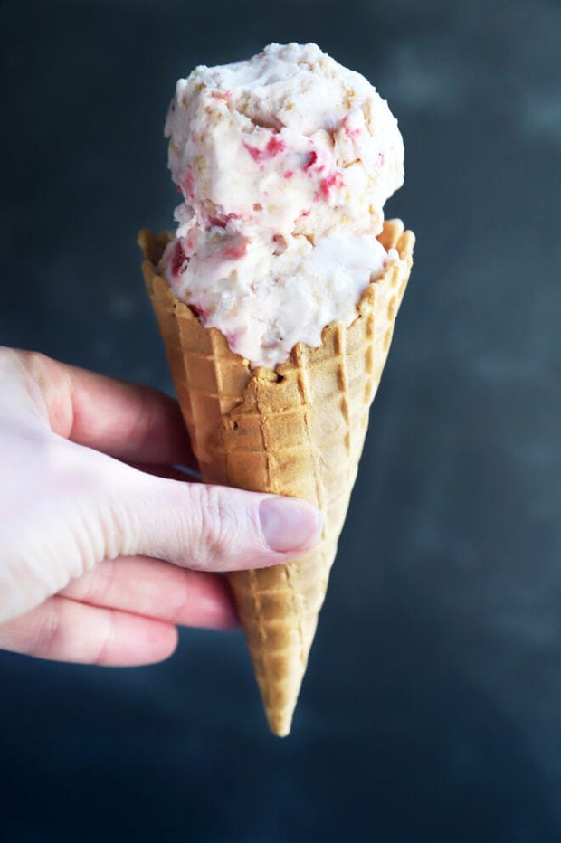 Hand holding ice cream cone photo