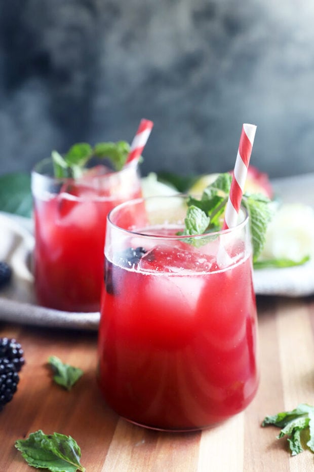 Side photo of blackberry cocktail in glasses