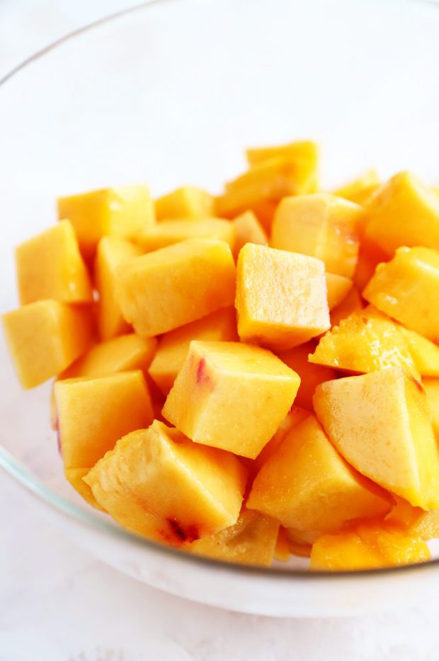 Peeled and chopped peaches in a bowl photo