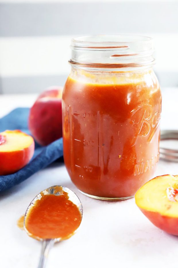 Side photo of peach bbq sauce in a jar