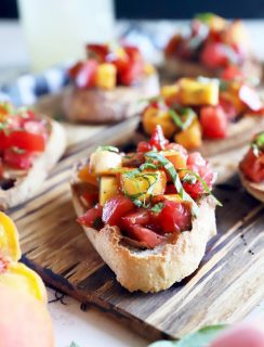 Summer tomato peach bruschetta on platter photo