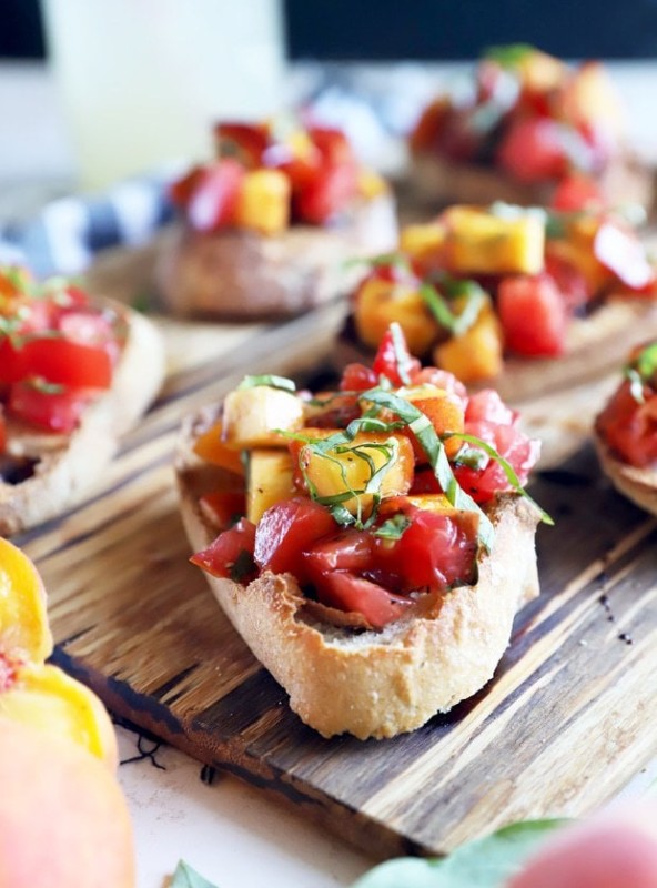 Summer tomato peach bruschetta on platter photo