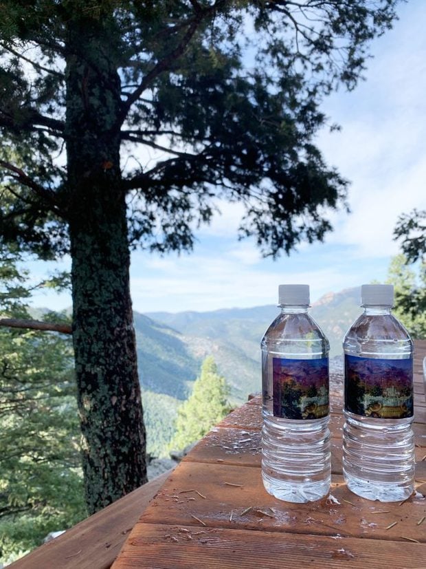 Bottled water next to hot tub at Cloud Camp