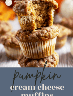 Three pumpkin cream cheese streusel muffins are stacked, with the top muffin showing a bite taken out to reveal a creamy filling. The text pumpkin cream cheese muffins appears at the bottom.
