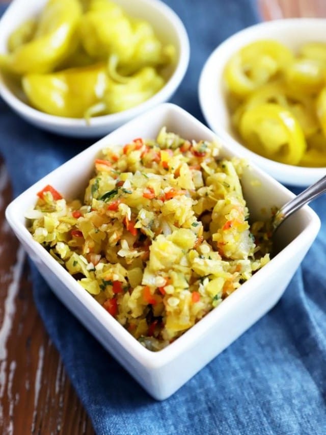 Side image of pepperoncini and jalapeño in bowl