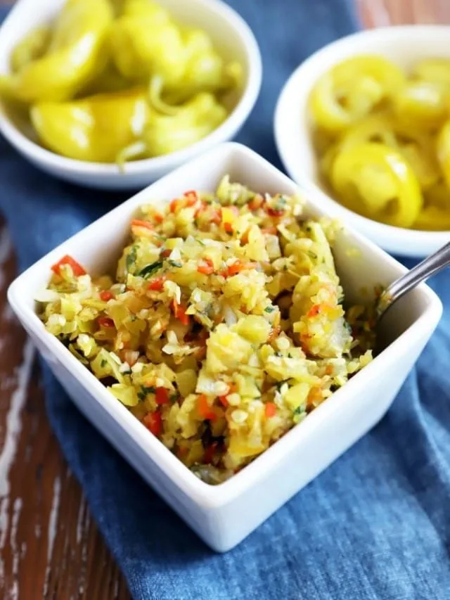 Side image of pepperoncini and jalapeño in bowl