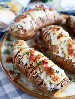 Cheesy hasselback sweet potatoes on plate image