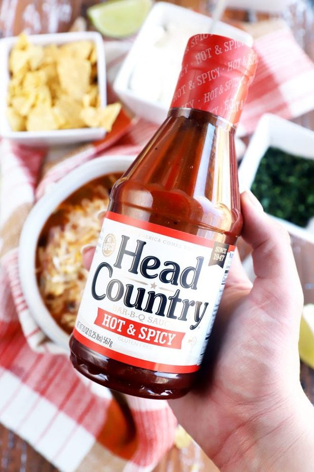 hand holding head country bottle image