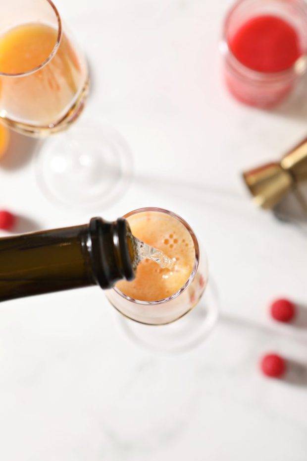 champagne being poured into glass photo