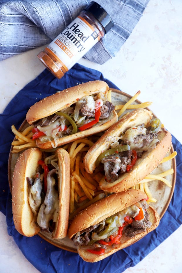 Overhead photo of cheesesteaks on plate