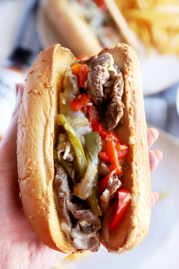 Hand holding Instant Pot philly cheesesteaks image