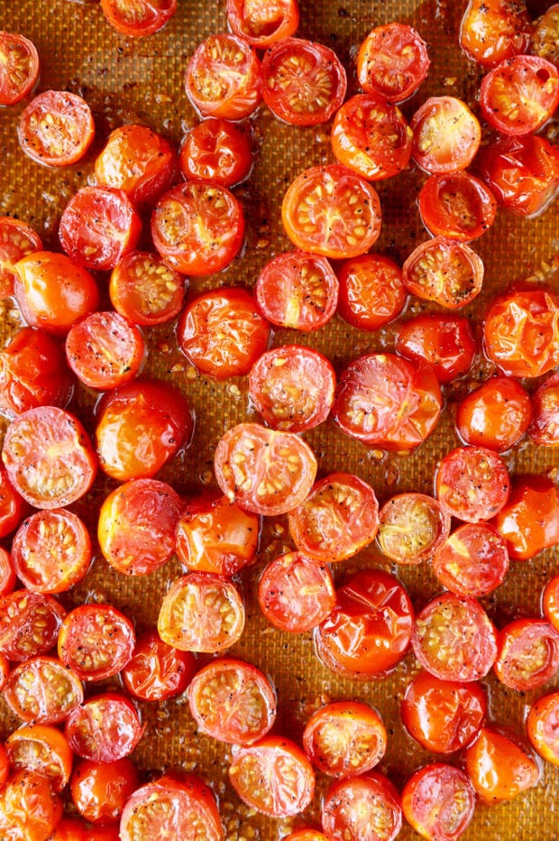 roasted cherry tomatoes on baking sheet image