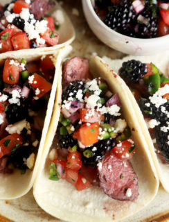Steak tacos on platter with blackberry salsa image