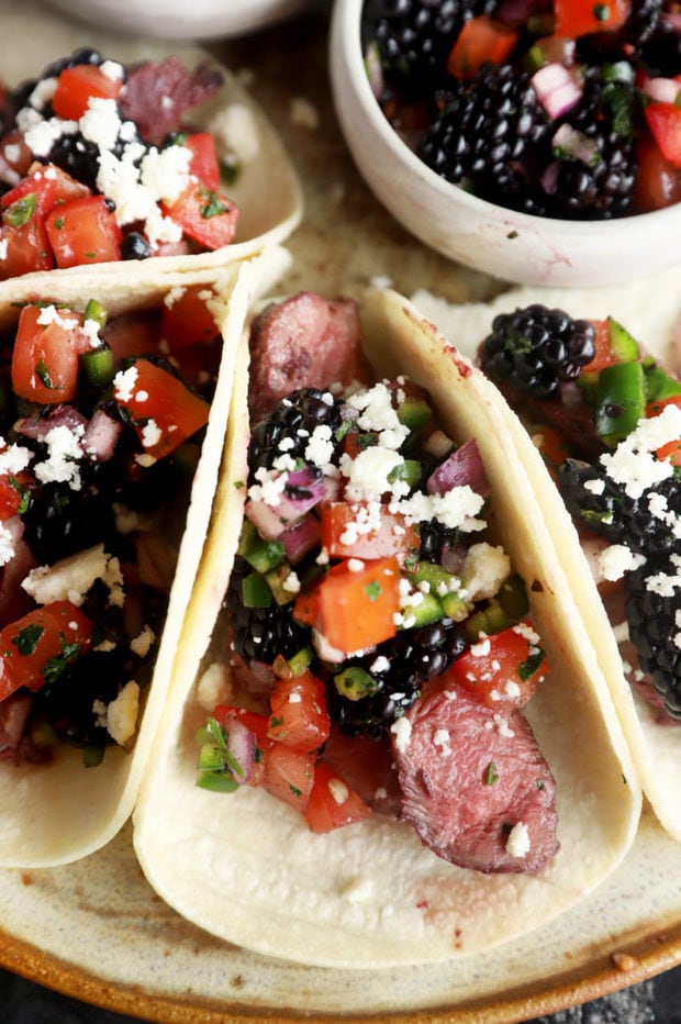 Steak tacos on platter with blackberry salsa image