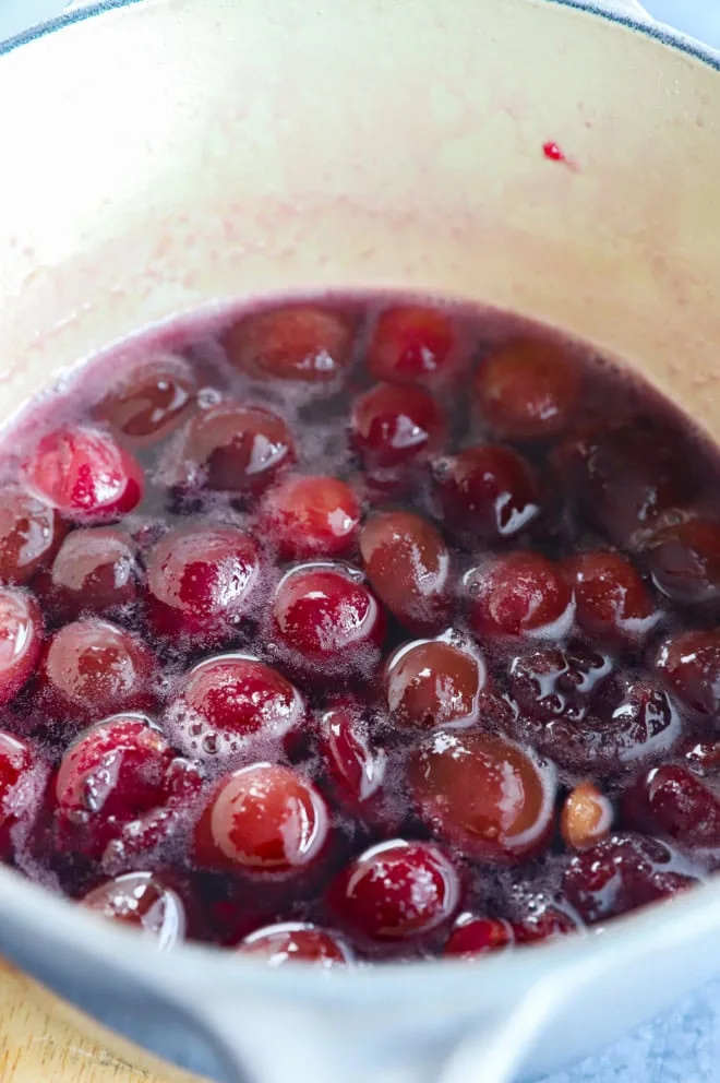 making cherry simple syrup in a saucepan