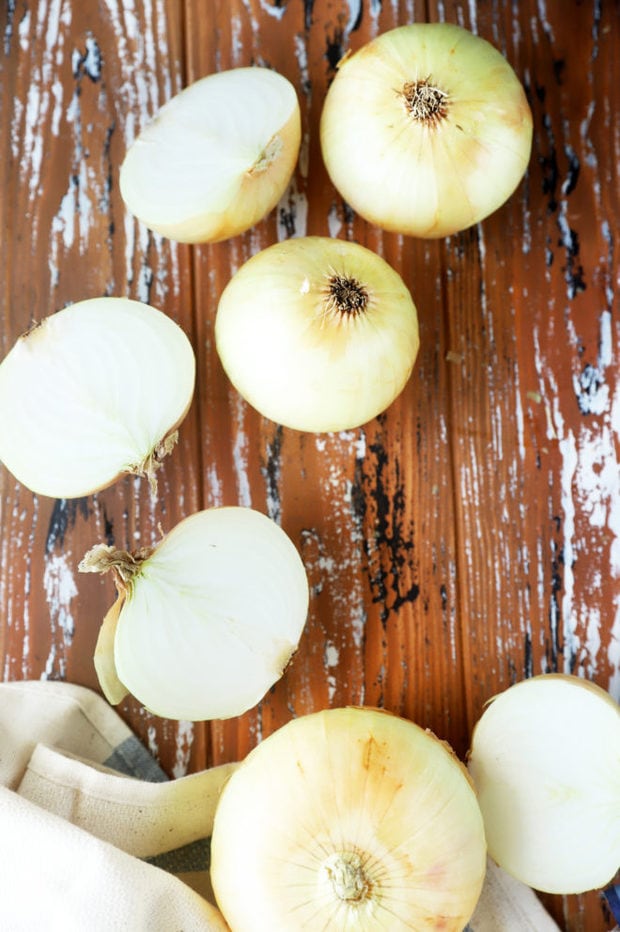 Overhead photo of onions whole and halved