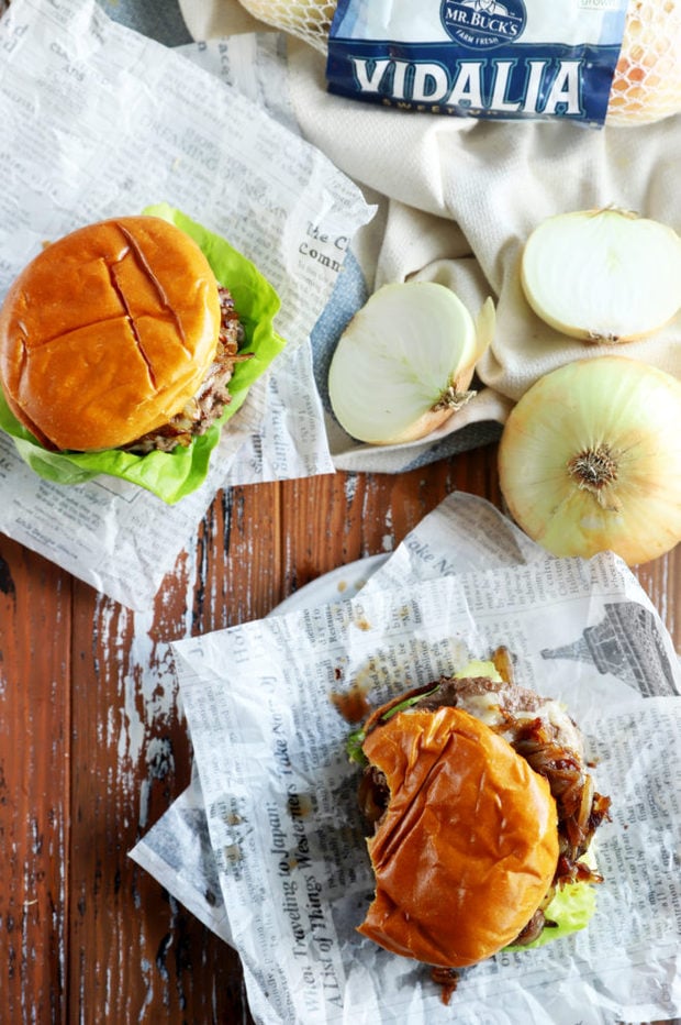 Overhead photo of burger with bites taken out of it