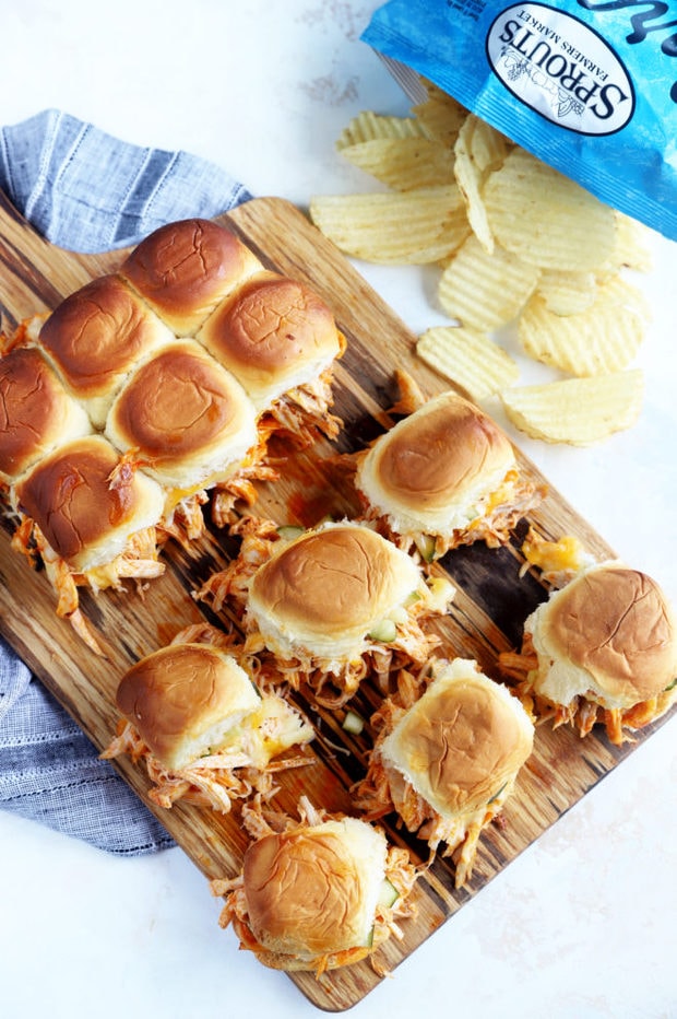 Sliders on a board with potato chips image