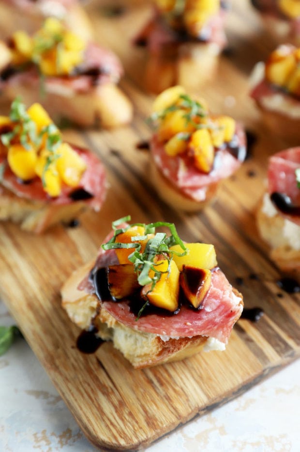 Salami peach ricotta crostini on platter image