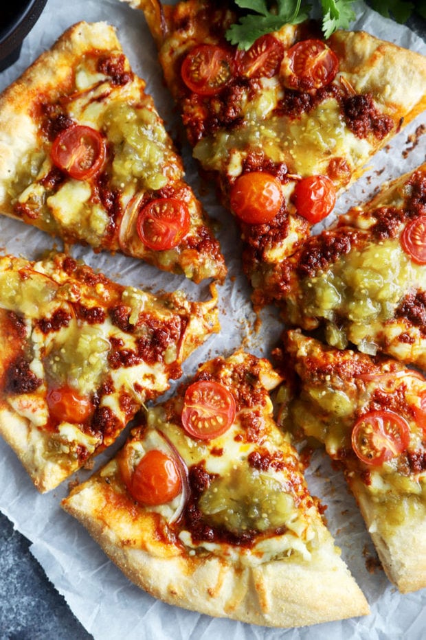 Slices of salsa verde chorizo pizza image