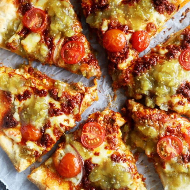 Slices of salsa verde chorizo pizza image