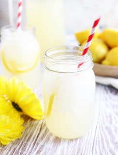 Yellow flowers and lemonade in jars picture