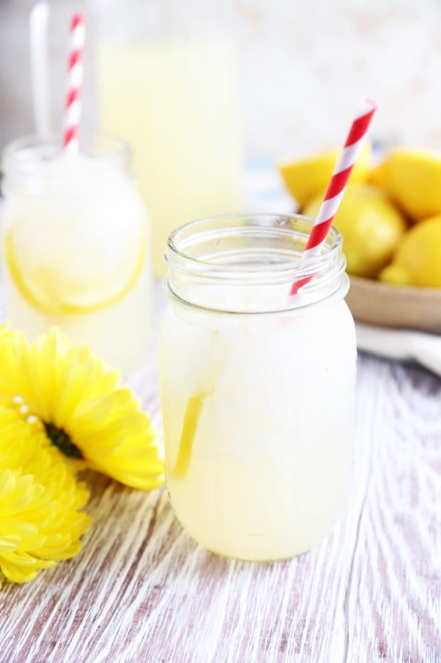 Yellow flowers and lemonade in jars picture