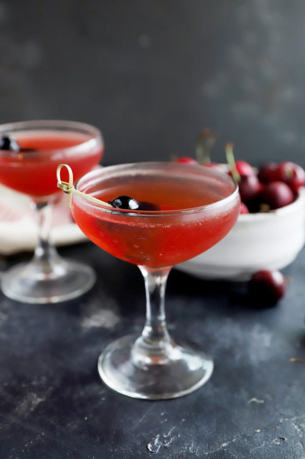 Photo of cherry cocktail in coupe glasses