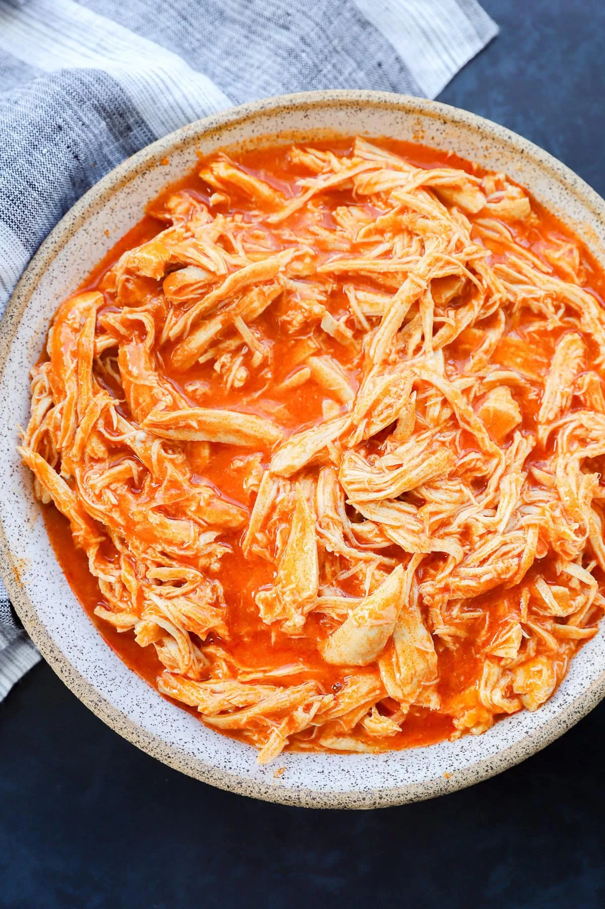 Instant Pot Buffalo Chicken in a bowl with napkin
