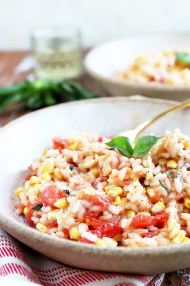 Side photo of tomatoes and corn in risotto