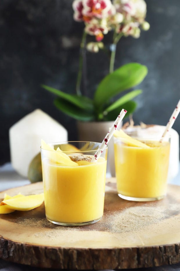 Side view of mango smoothie in glasses image